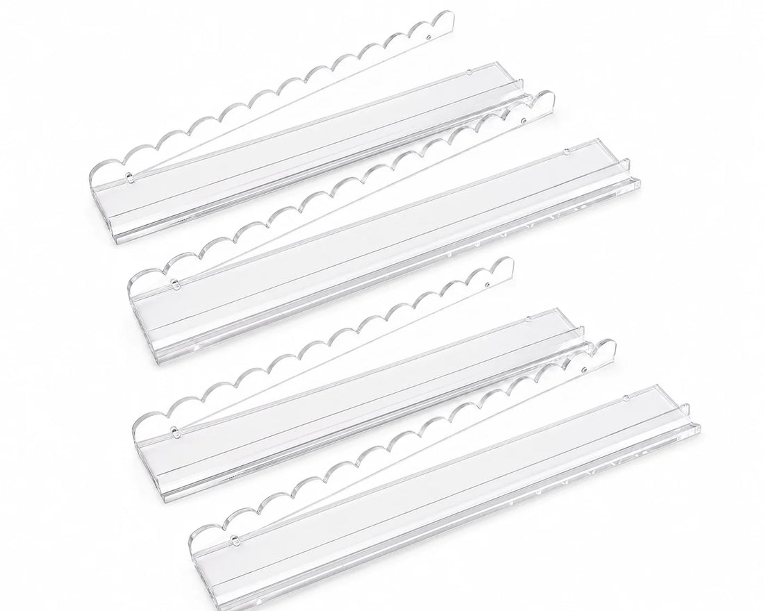 Clear American Mahjong racks and tile pushers on a white background