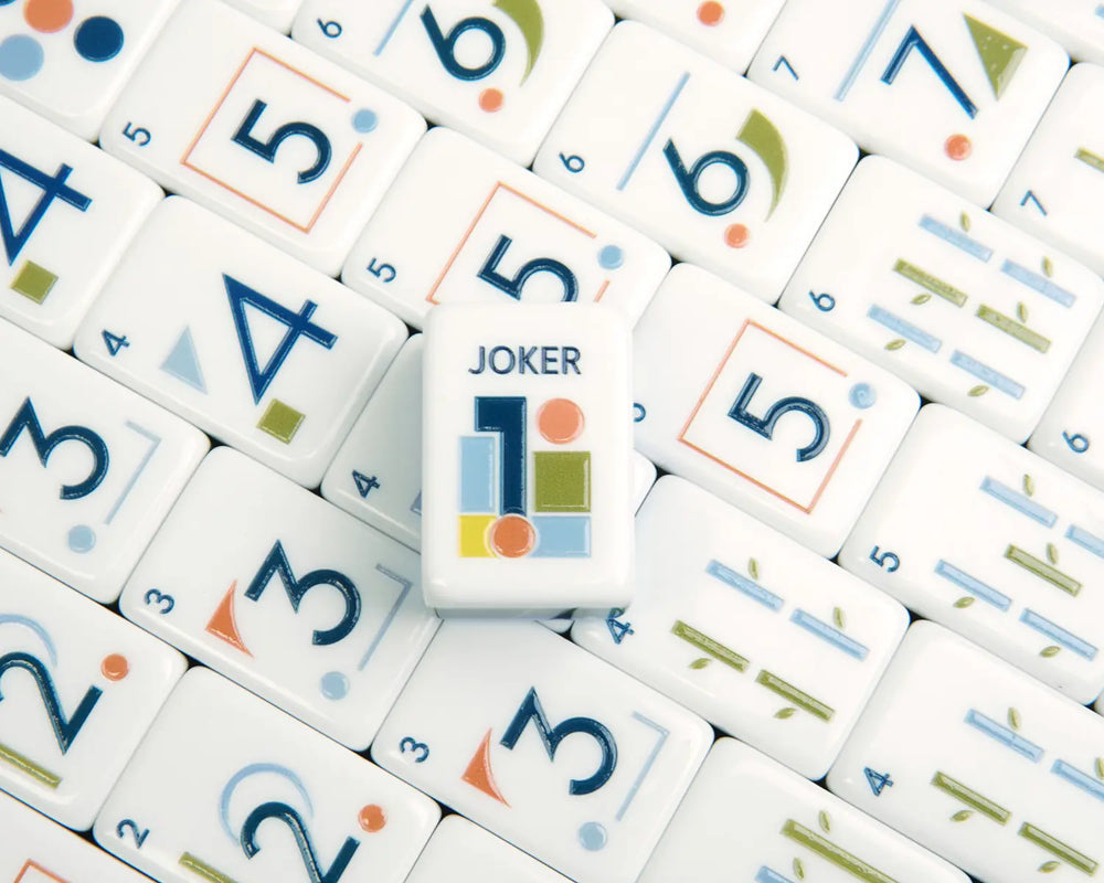 Close-up of Blooming Geometry numbered American Mahjong tiles and Joker