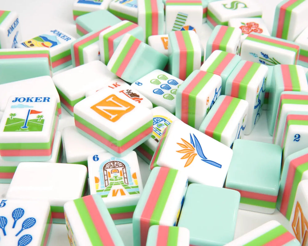 Blue Manor American Mahjong tiles scattered with seafoam backs and colorful faces
