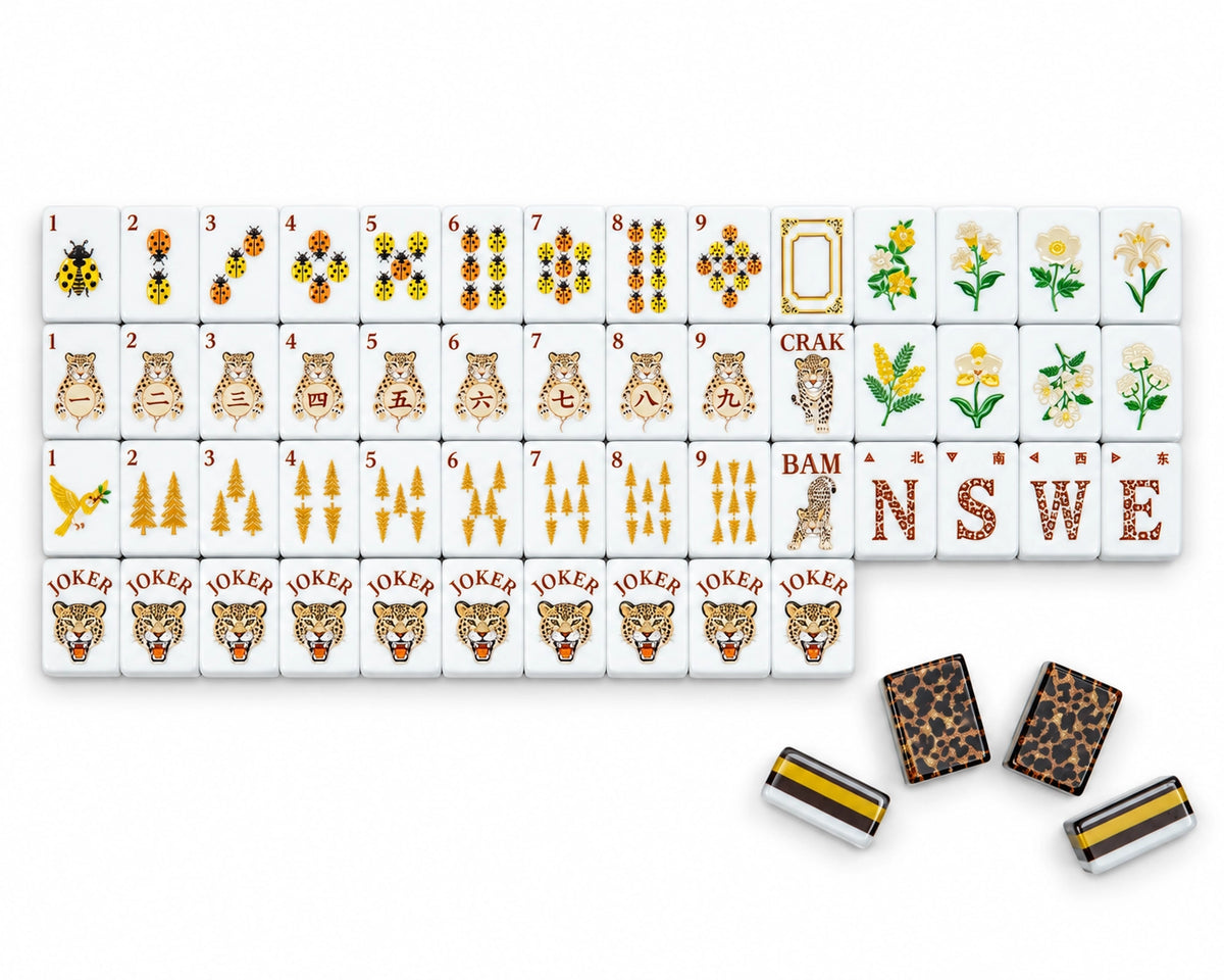 Golden Wilds American Mahjong set arranged with ladybug Dots, golden tree Bams, leopard Craks, flowers, winds, Jokers and tile backs