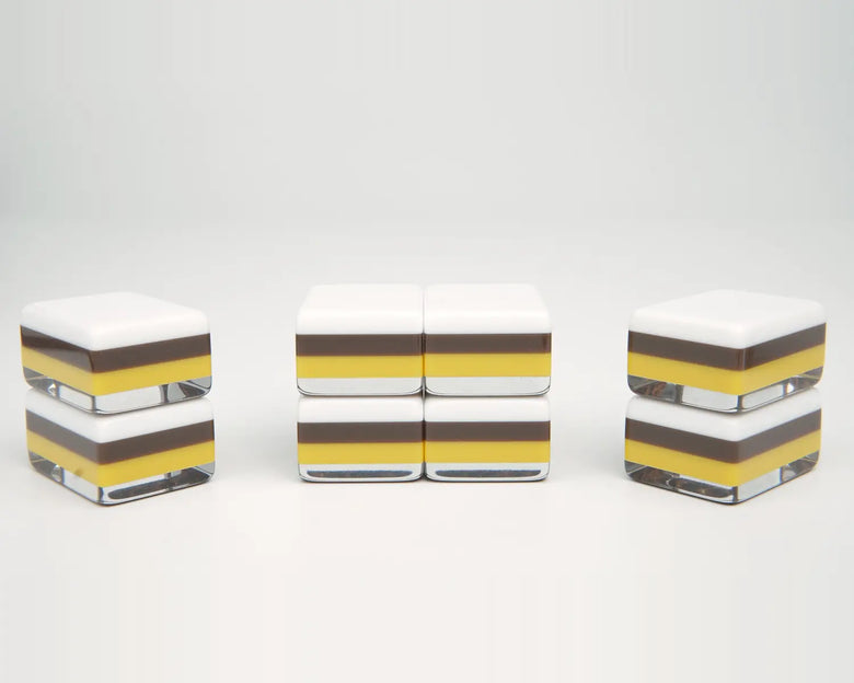 Side profile of Golden Wilds tiles showing white faces, brown and yellow layers, and clear bases