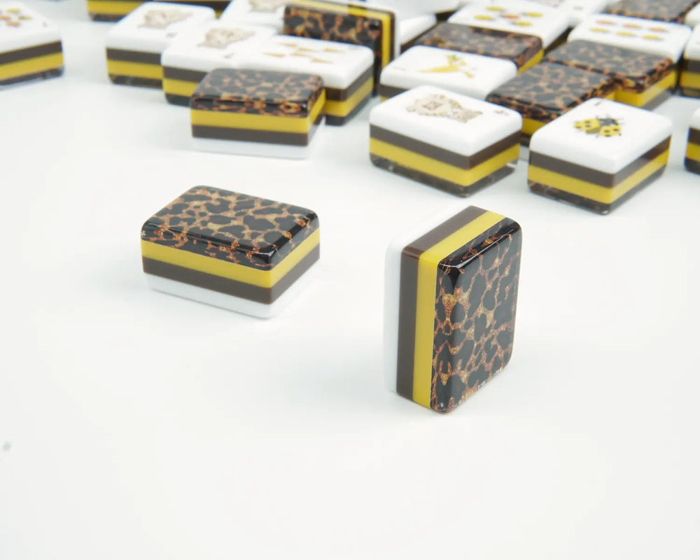 Close-up of Golden Wilds layered yellow and brown sides and leopard tile backs