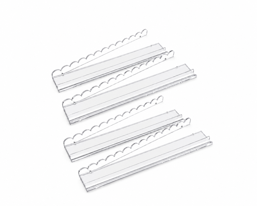 Set of four crystal-clear acrylic Mahjong tile pushers with scalloped edges, fully visible on a white background
